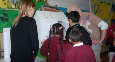 Pupils playing with the Eco house